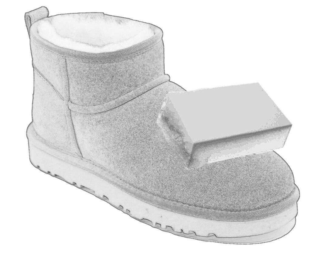 applying UGG cleaner to sponge